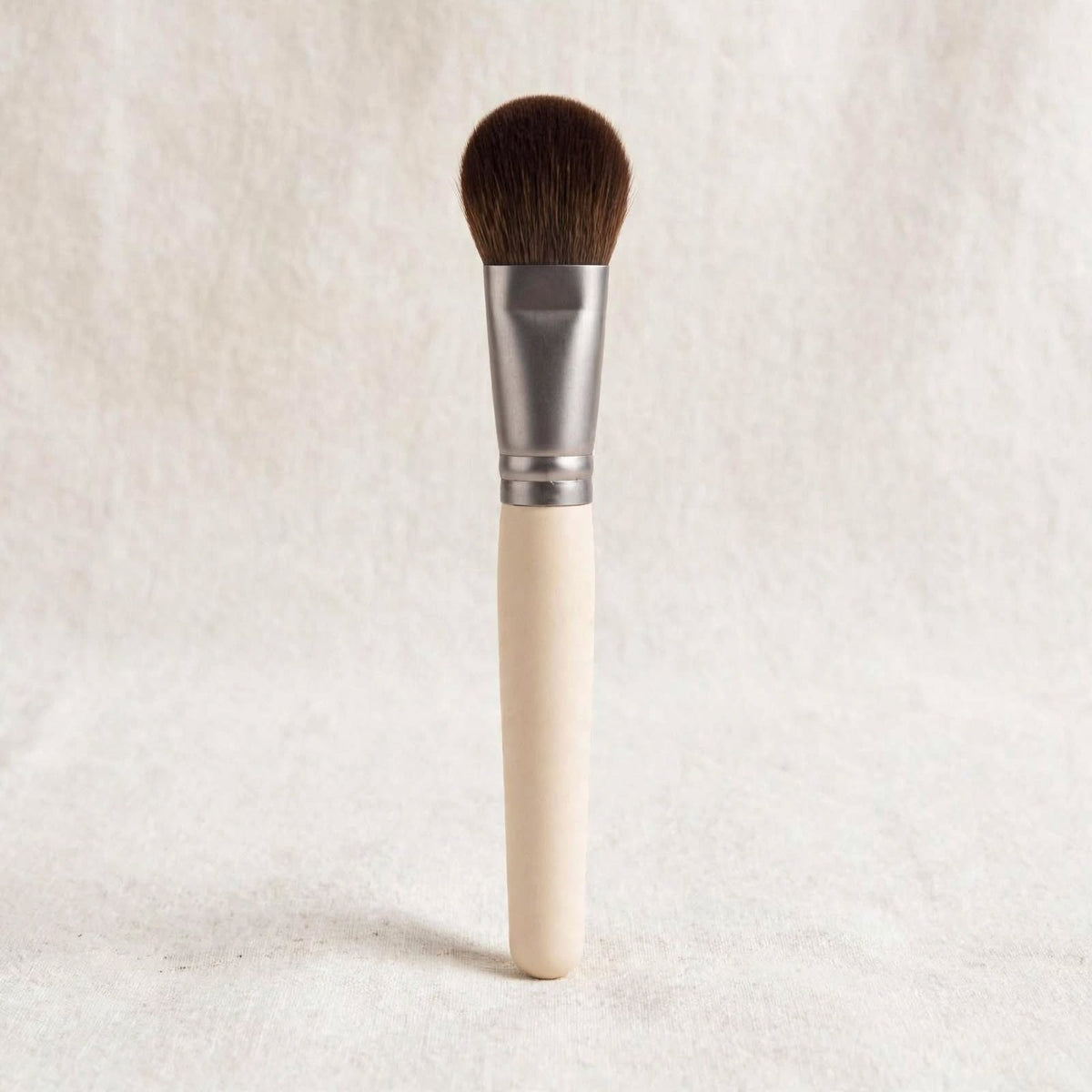 Cream handle blending brush standing