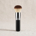 Black kabuki buffing brush standing
