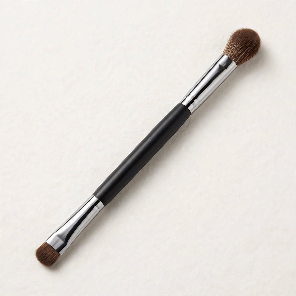 Double ended eyeshadow brush lying flat