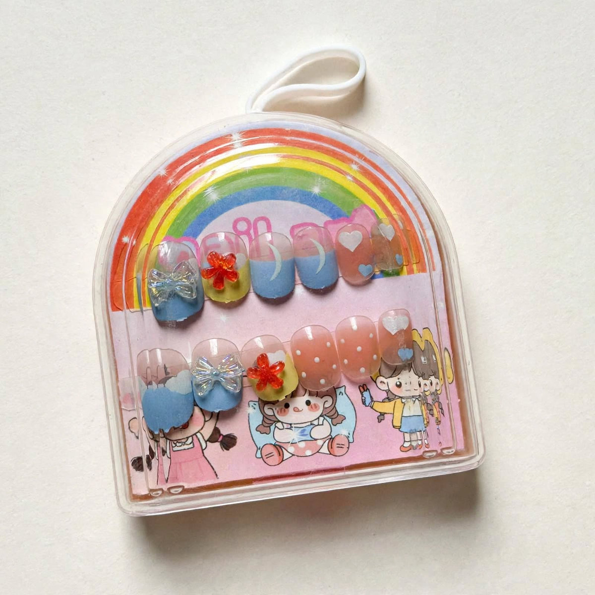 Peach and Blue Bows kids press-on nails, angled