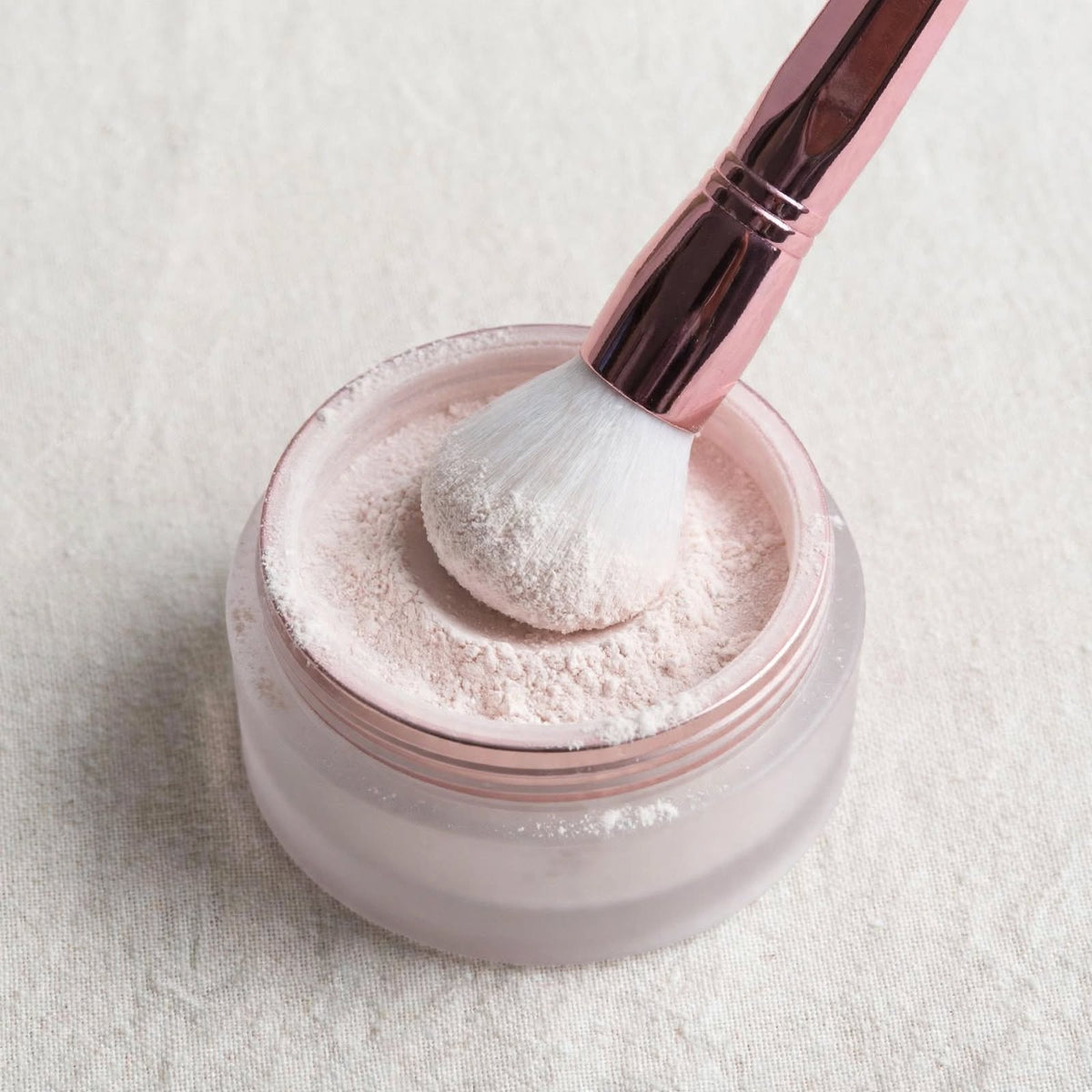 Rose pink powder brush in loose powder
