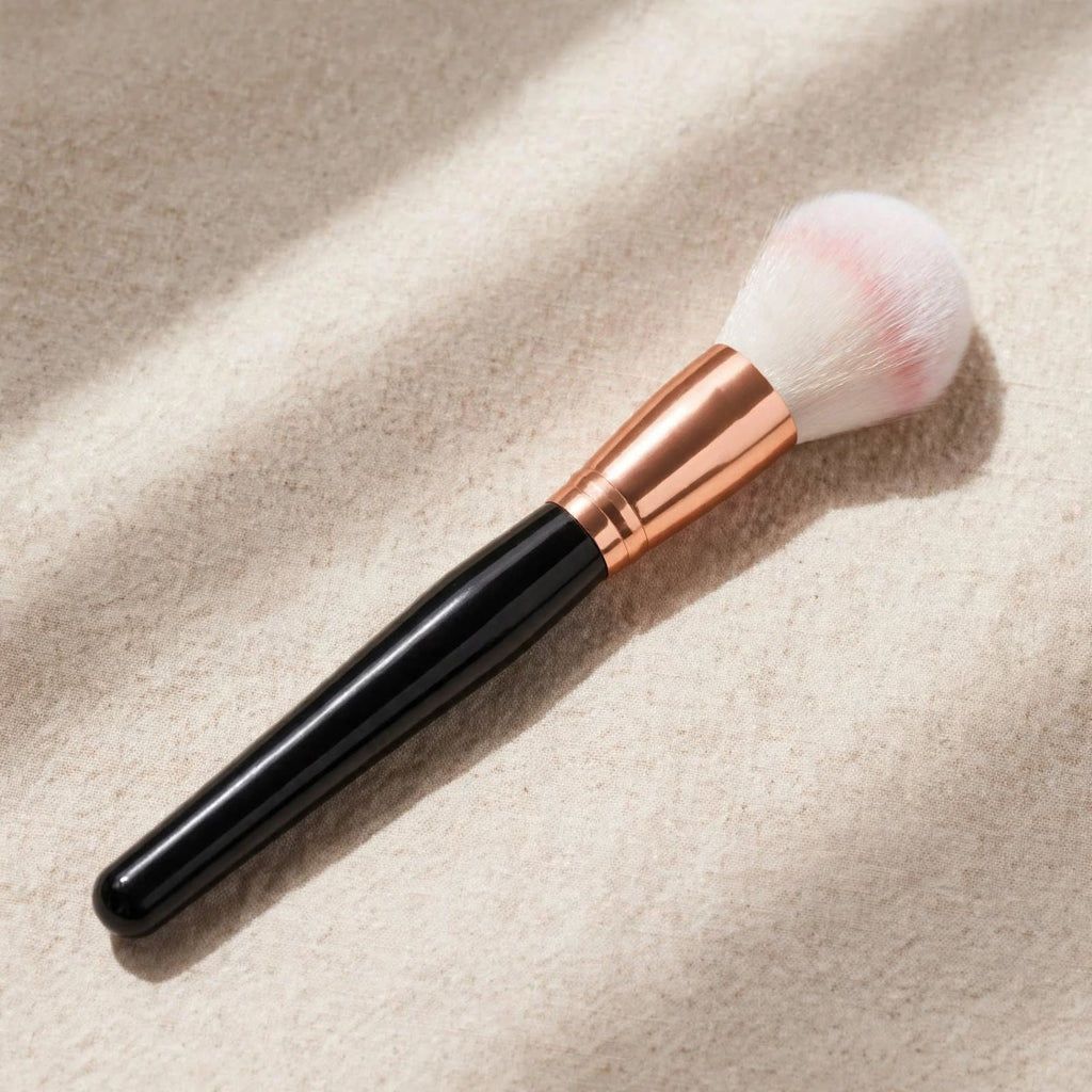 Black handle powder brush with pink tipped bristles