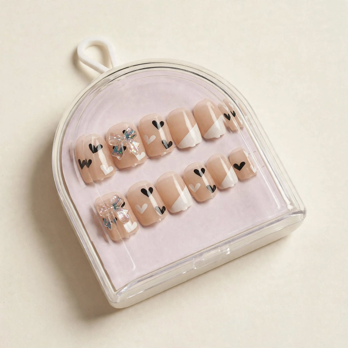 Nude Hearts short press-on nails, angled