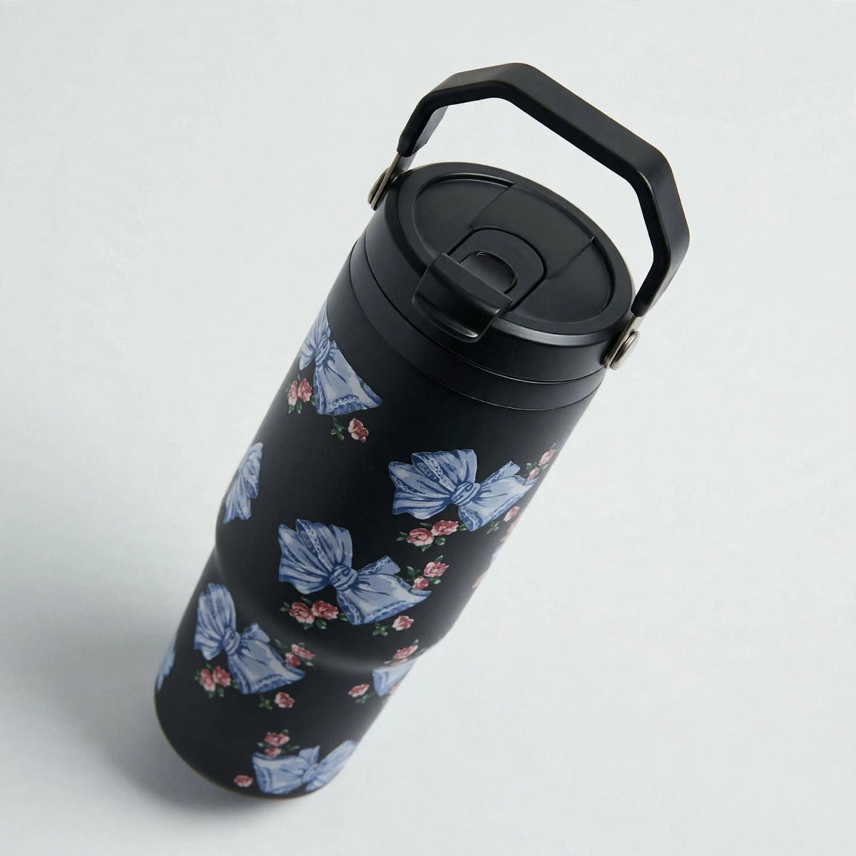 Black ribbon coquette travel tumbler, angled