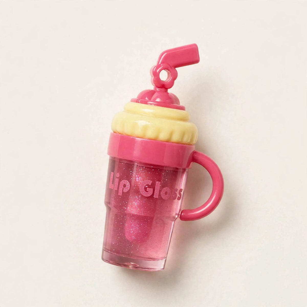 Cup shaped lip gloss with straw lid, angled