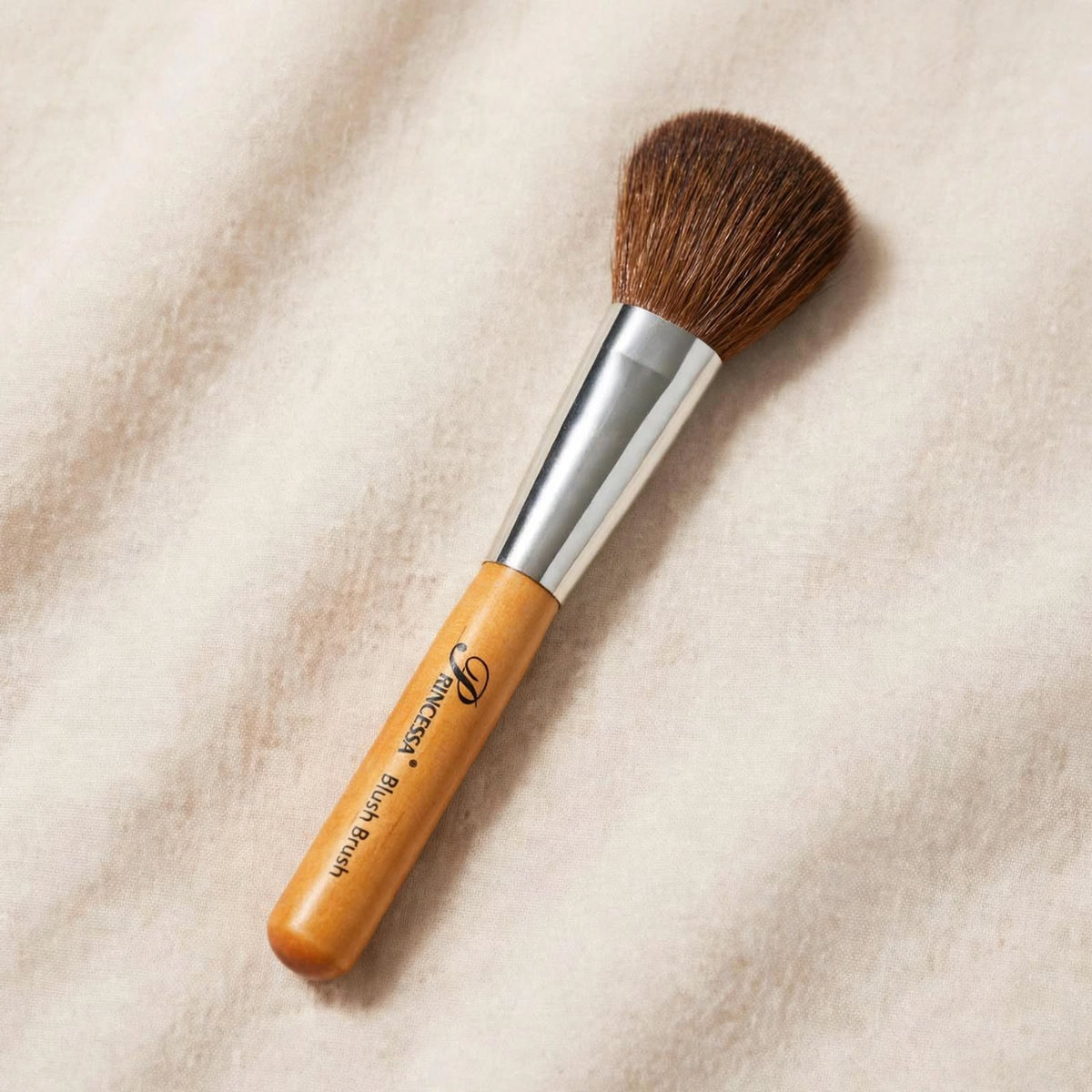 Precious wooden handle powder brush lying flat