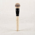 Natural wood buffing brush standing